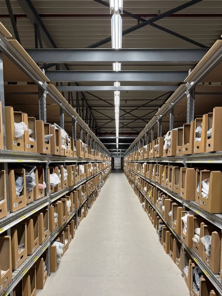 Warehouse aisle with shelving and stocked cartons